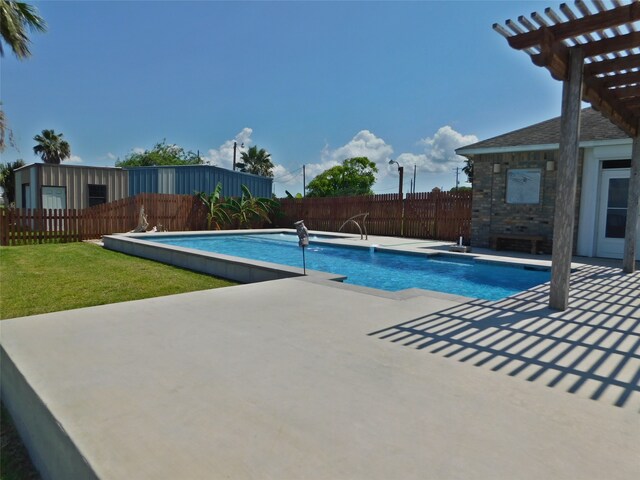 view of pool featuring a patio and a lawn