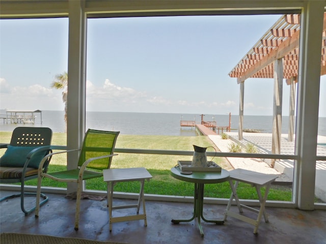 sunroom with a water view