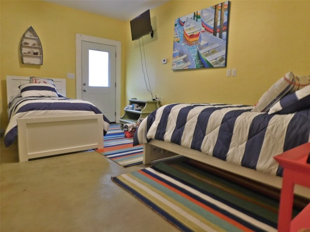 bedroom with concrete floors