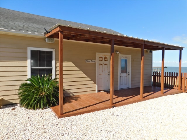 doorway to property with a water view