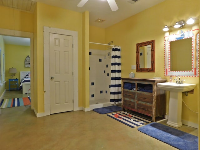 bathroom with concrete floors, curtained shower, and ceiling fan