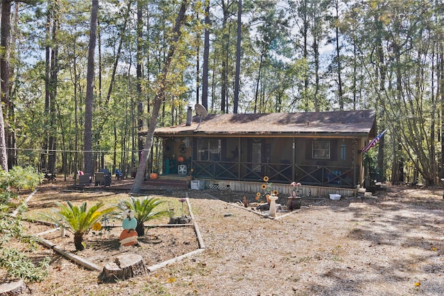 back of property featuring a sunroom