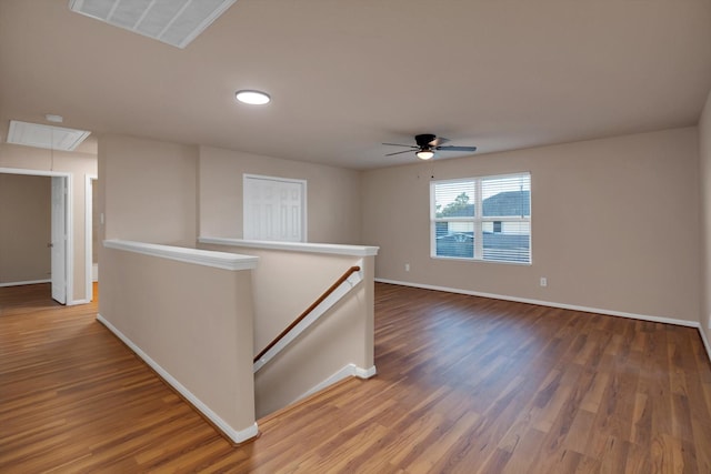 unfurnished room featuring hardwood / wood-style flooring and ceiling fan