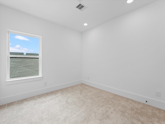 unfurnished room featuring carpet floors