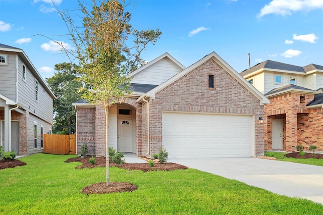 view of front of property featuring a garage and a front lawn