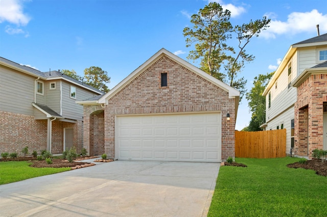 front facade featuring a front yard and a garage