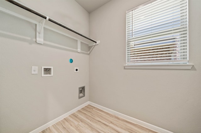 laundry area with gas dryer hookup, light wood-type flooring, plenty of natural light, and electric dryer hookup