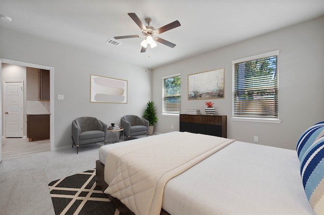 carpeted bedroom with ceiling fan