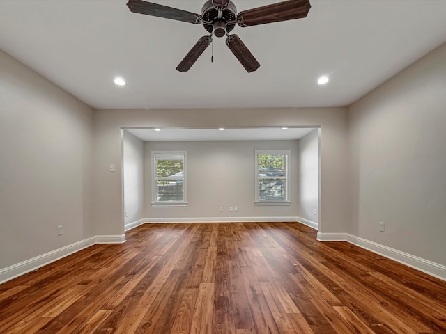 empty room featuring ceiling fan and hardwood / wood-style flooring