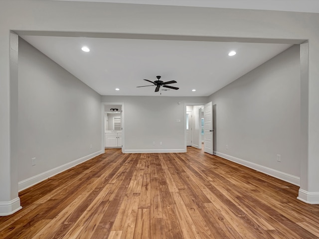 unfurnished living room with hardwood / wood-style floors and ceiling fan