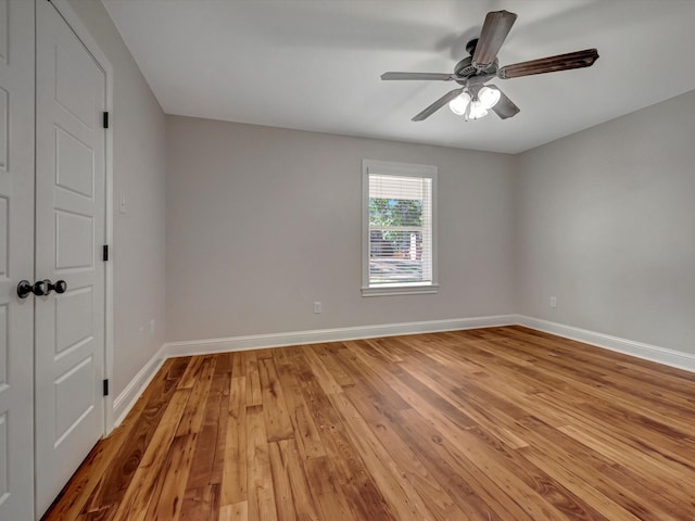 empty room with light hardwood / wood-style flooring and ceiling fan