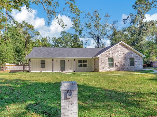 ranch-style house with a front yard