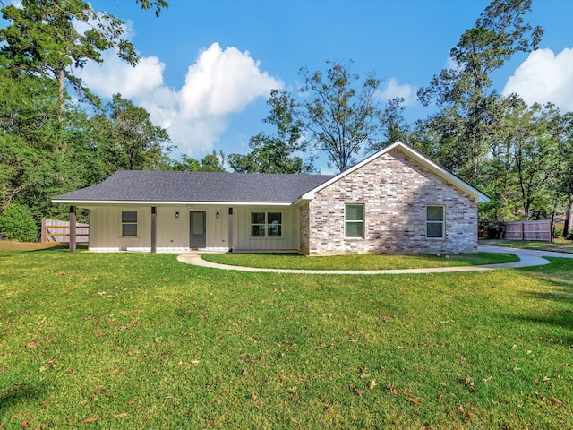 ranch-style home with a front lawn