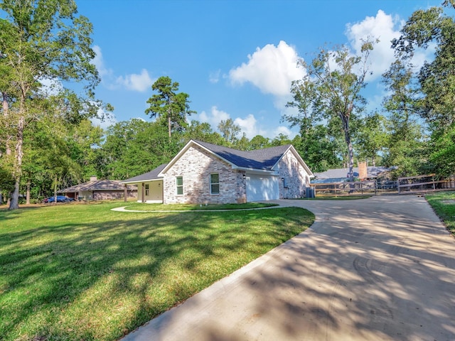 view of front facade featuring a front lawn and a garage