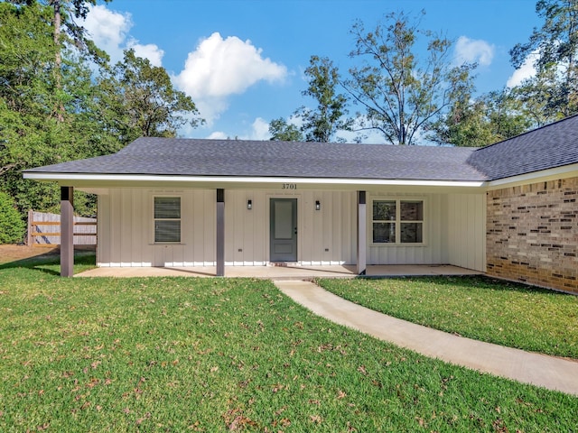 ranch-style home with a front lawn