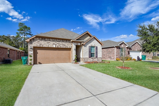 view of front of house with a front yard and a garage