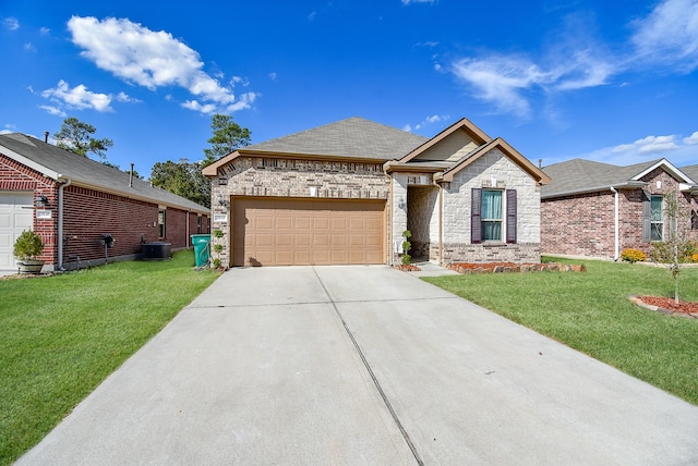 view of front of home with a garage and a front lawn