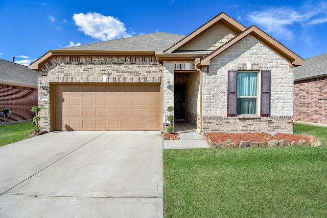 view of front of property featuring a front yard and a garage