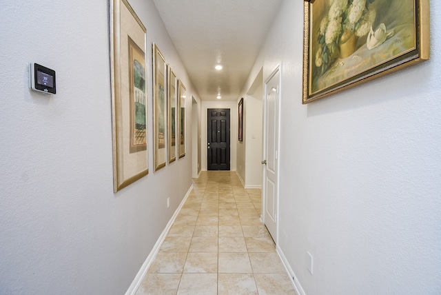 corridor featuring light tile patterned floors