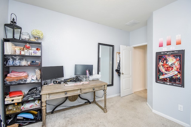 office area featuring light carpet