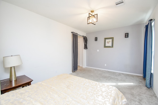 bedroom with light carpet