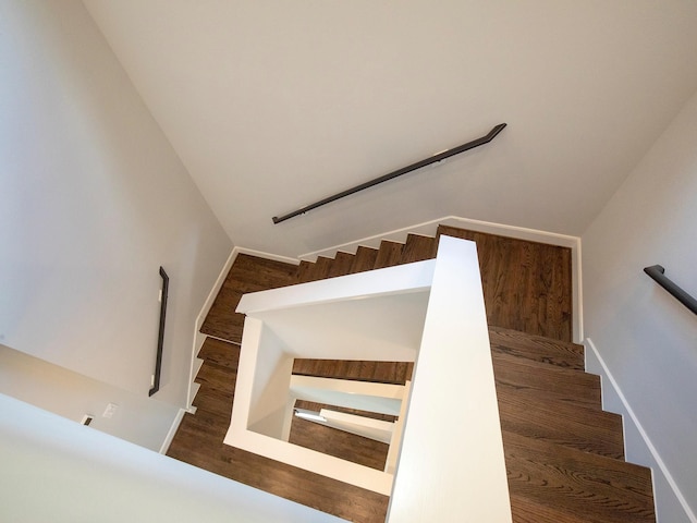 stairway featuring hardwood / wood-style flooring