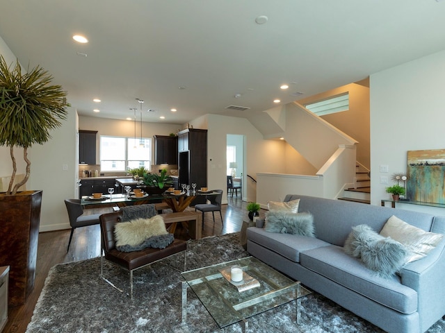 living room with dark hardwood / wood-style floors