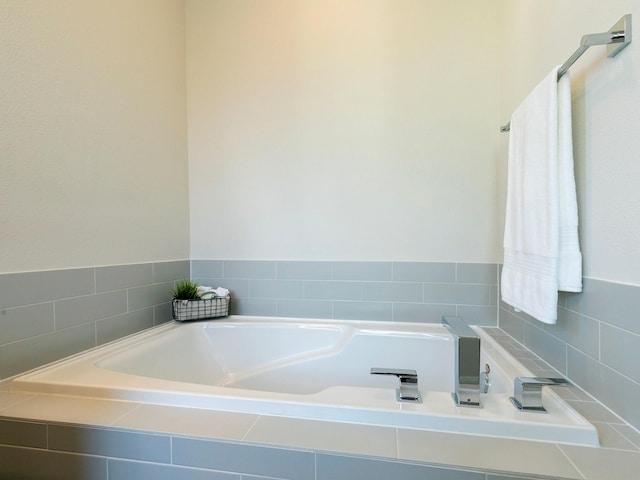 bathroom with tiled tub