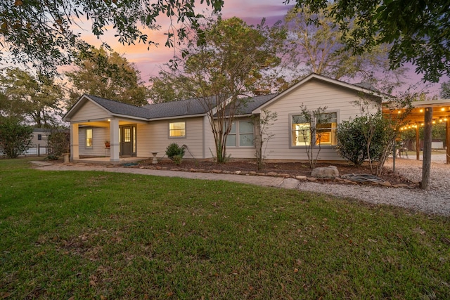 view of front of home featuring a lawn