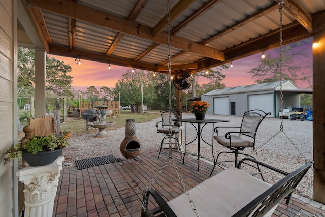 1726 Bowler Rd, Waller, TX 77484 - view of patio featuring fence, a garage, outdoor dining space, and an outbuilding