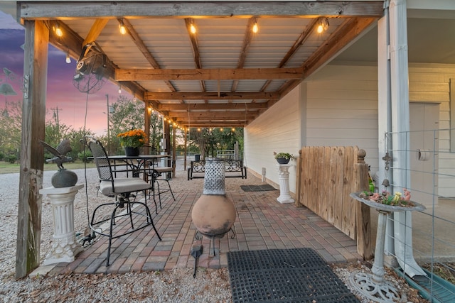 view of patio terrace at dusk