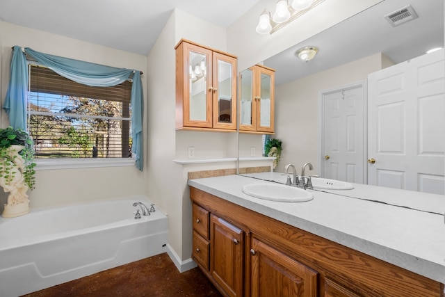 bathroom featuring vanity and a washtub