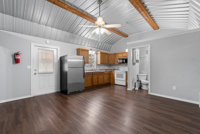 kitchen featuring lofted ceiling with beams, electric range, plenty of natural light, dark wood-type flooring, and stainless steel refrigerator