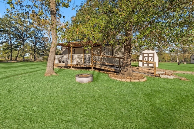 1726 Bowler Rd, Waller, TX 77484 - view of yard featuring a wooden deck, a shed, and an outbuilding