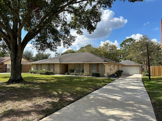 ranch-style house featuring a front lawn and a garage