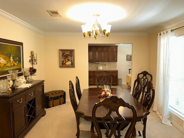 carpeted dining area with crown molding and an inviting chandelier