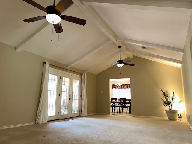 unfurnished living room with carpet flooring, vaulted ceiling with beams, plenty of natural light, and ceiling fan with notable chandelier