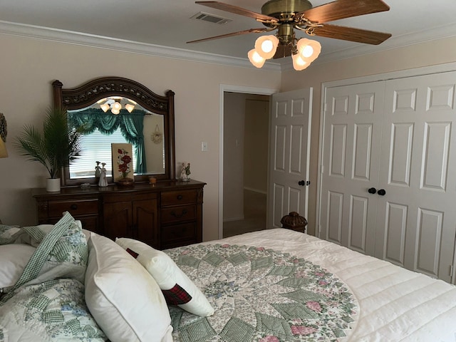 bedroom featuring ceiling fan, a closet, and crown molding