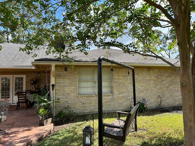 view of home's exterior featuring a yard and a patio