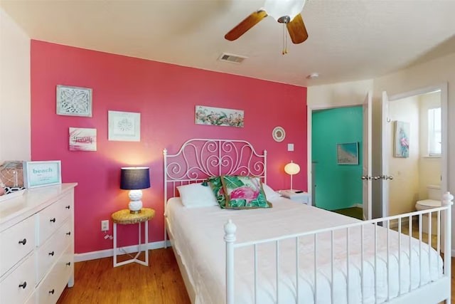 bedroom with light hardwood / wood-style floors and ceiling fan