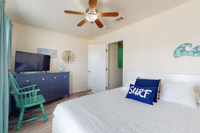 bedroom featuring light wood-type flooring and ceiling fan