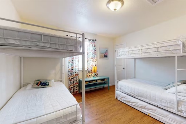 bedroom featuring hardwood / wood-style floors