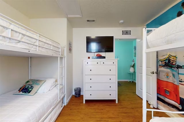 bedroom with light hardwood / wood-style flooring