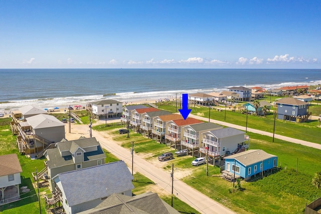 bird's eye view with a view of the beach and a water view