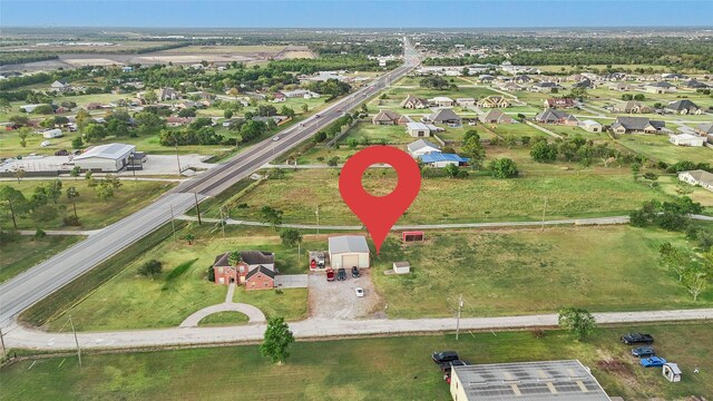 6530 Fm 3180 W, Mont Belvieu, TX 77523 - aerial overview of property's location featuring nearby suburban area