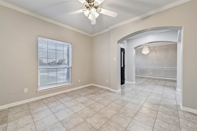 tiled spare room with crown molding and ceiling fan