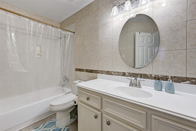 full bathroom with toilet, tile patterned flooring, vanity, shower / tub combo with curtain, and tile walls