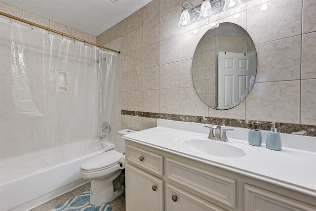 6530 Fm 3180 W, Mont Belvieu, TX 77523 - bathroom with tile walls, shower / bath combo with shower curtain, vanity, toilet, and tile patterned flooring