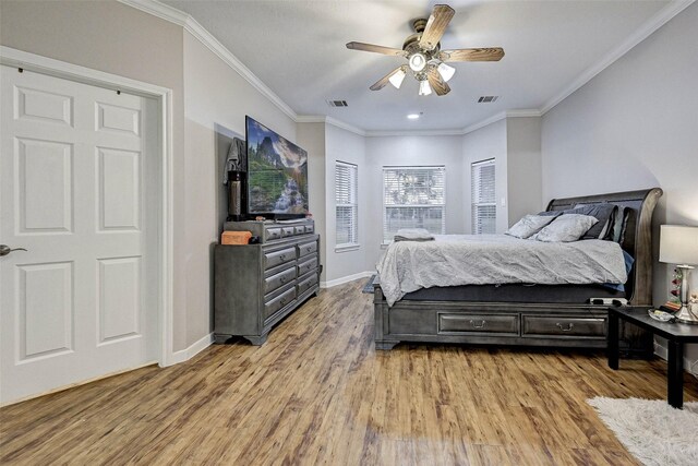 6530 Fm 3180 W, Mont Belvieu, TX 77523 - bedroom with light wood-style flooring, crown molding, baseboards, and ceiling fan