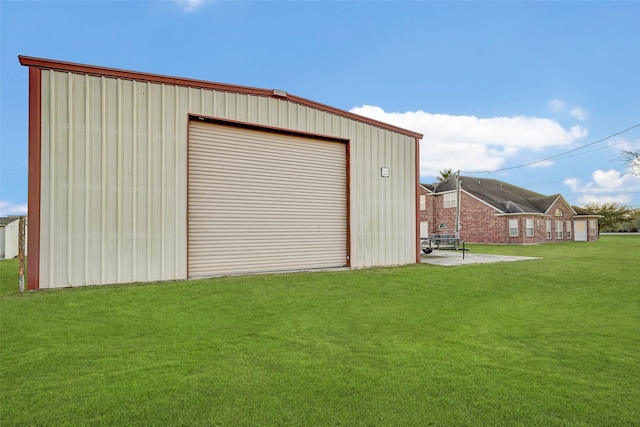 garage featuring a yard